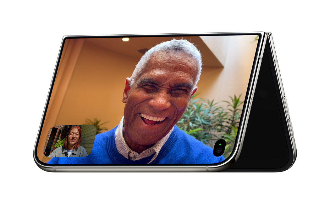 An iPhone Duo folded into a tent, standing on its edges during a FaceTime call.